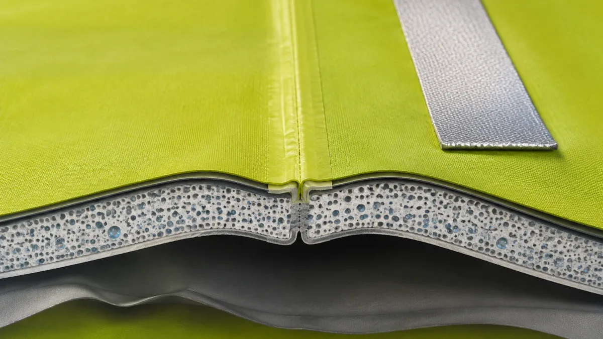 Close-up cross-section diagram showing ultrasonic weld seam on breathable polyester fabric with micro-porous coating layer visible, and reflective tap
